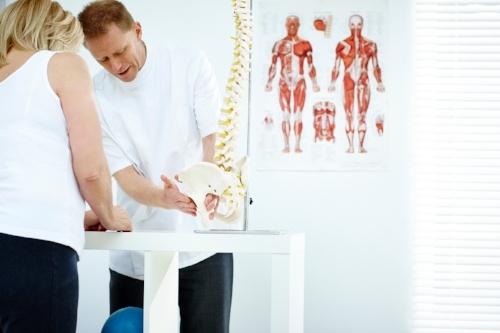 Punta Gorda, FL Car Wreck Physician talking to a patient about low back pain 