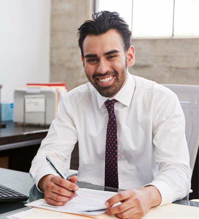 smiling lawyer at desk in Wisconsin
